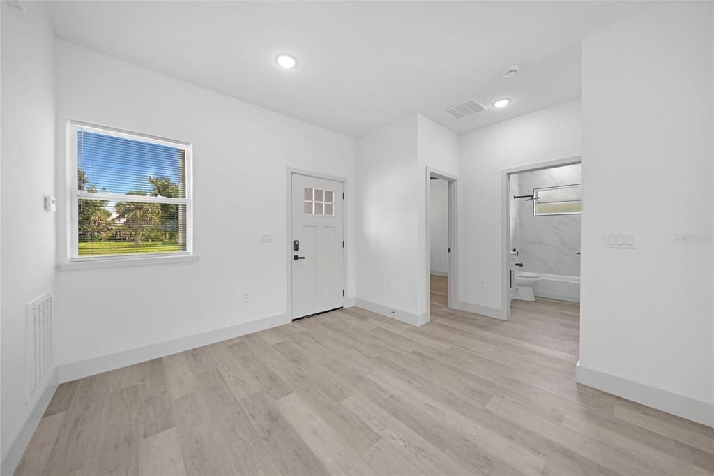 Entryway with Guest Bedroom and Bathroom on the right