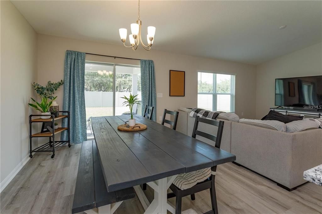 spacious dining area with backyard view