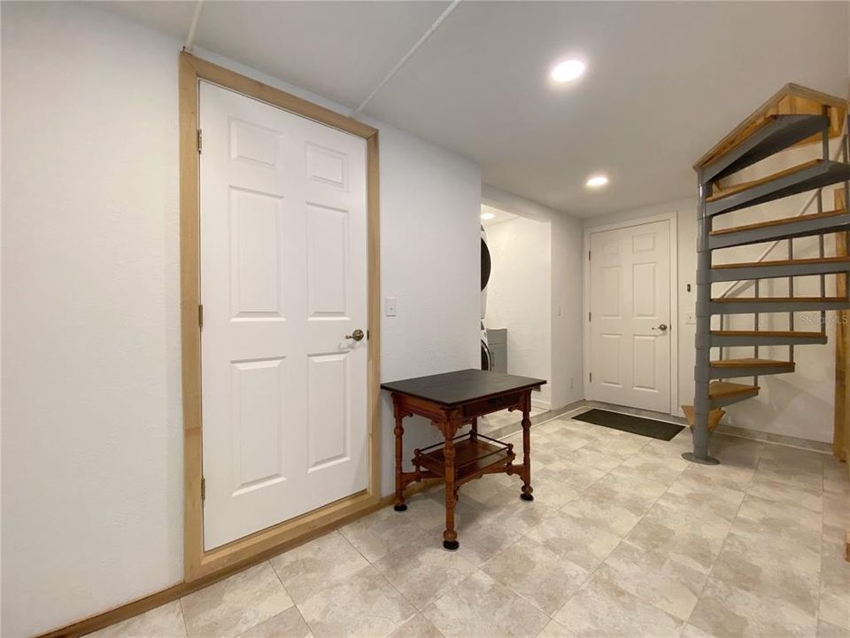 Door to 3rd Bath, Washer/Dryer, Wash Sink and Spiral Stairs