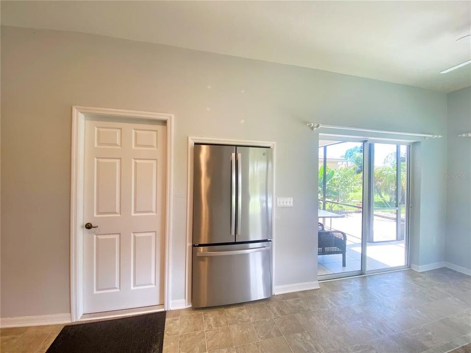 Door to Laundry Room and framed refrigerator