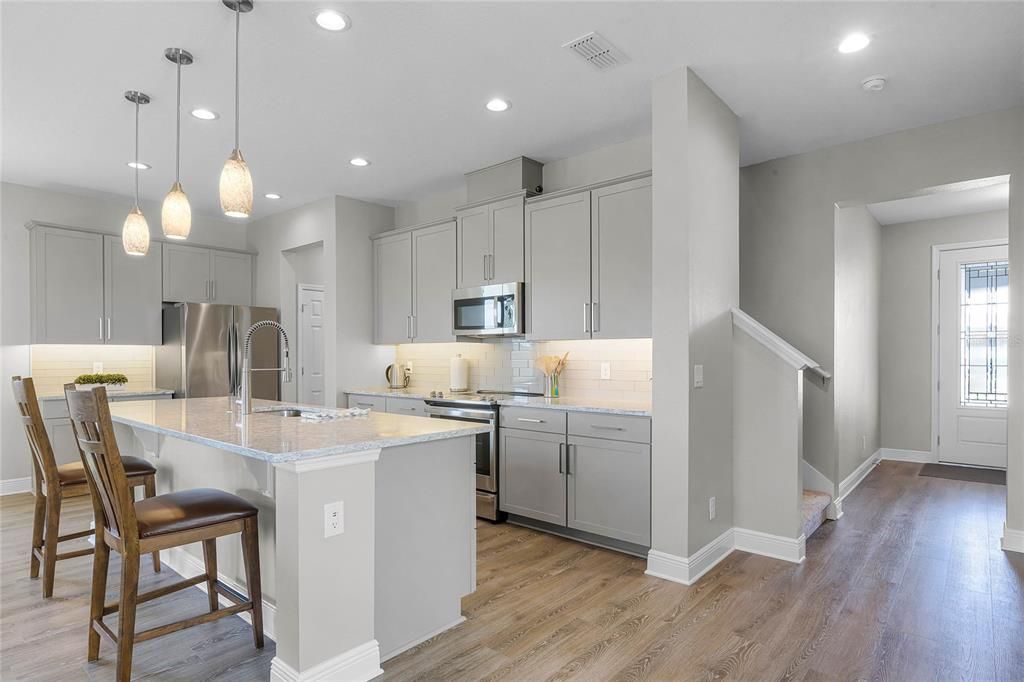 large counter-height island with pendant lighting