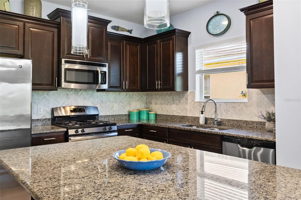 Kitchen stainless appliances, center island & granite counter tops