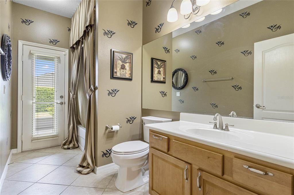 Bathroom 2 with a door to the Lanai