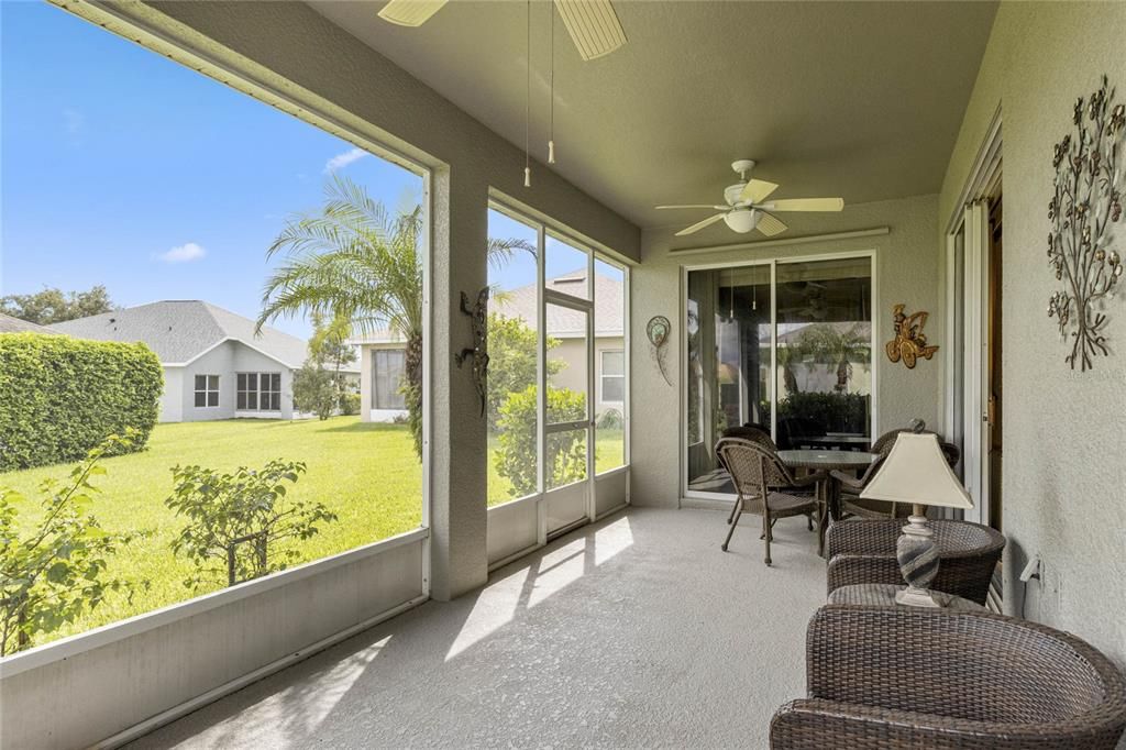 Oversized Lanai featuring two ceiling fans