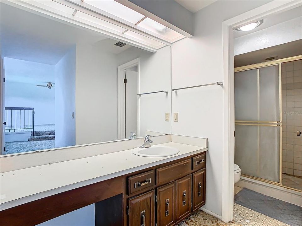 The primary bathroom with separate water closet and shower.