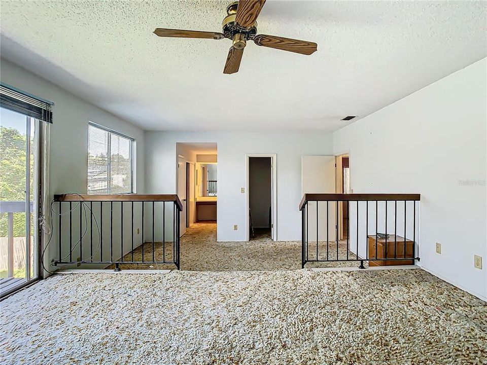 The primary bedroom has plenty of closet space leading into the ensuite bathroom.