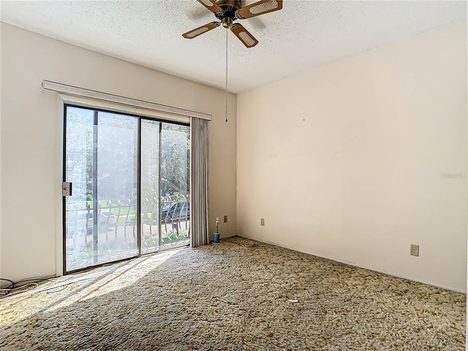 This guest bedroom is located at the end of the hall and looks out to the front street.