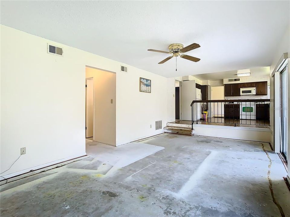 A view of the family room looking up to the kitchen.