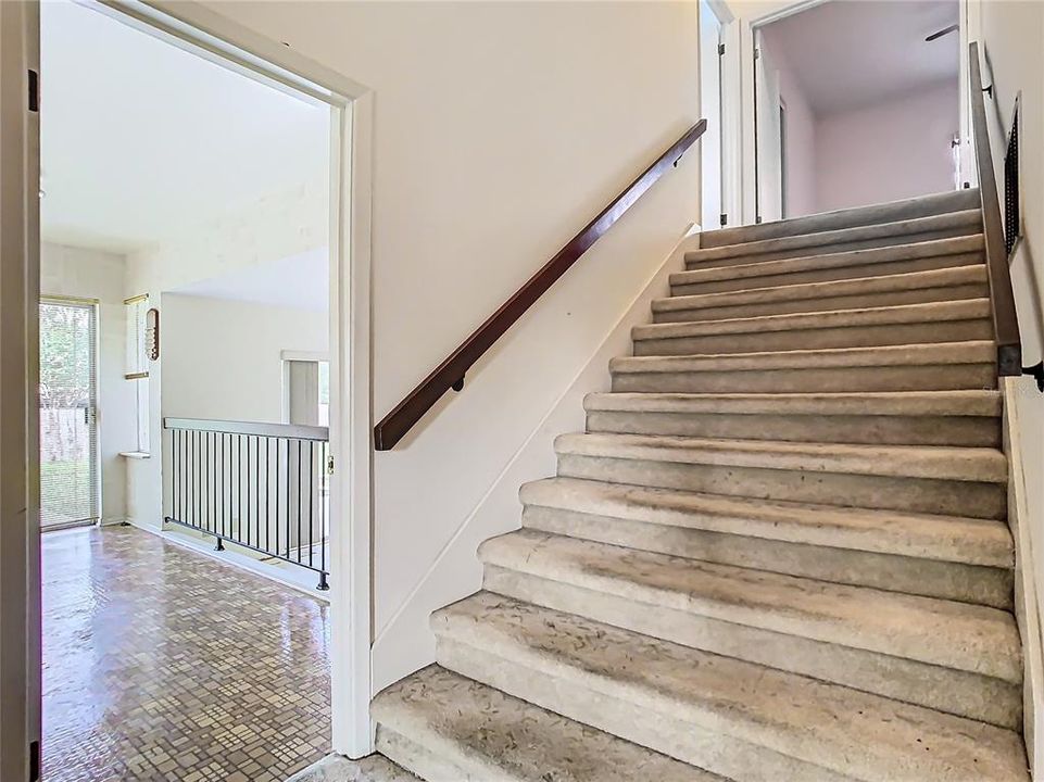 This wide staircase will allow for furniture to be easily moved upstairs.