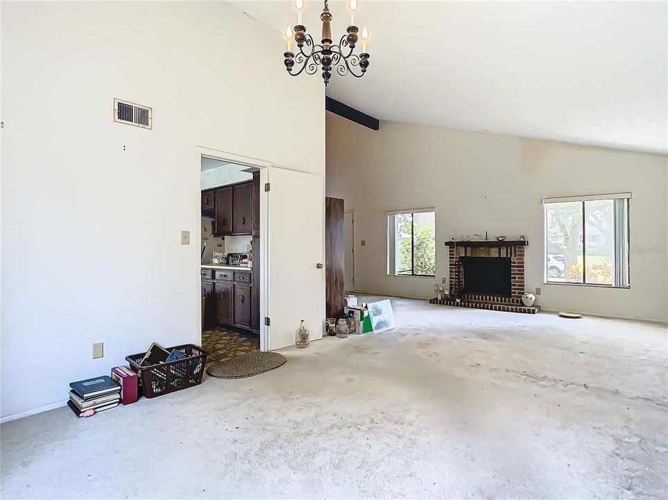 A view of the dining area that shows the wood burning fireplace.