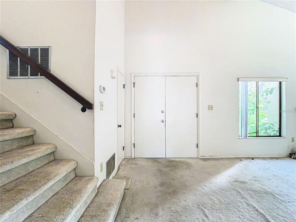 The wide staircase is right off the entrance into the home.