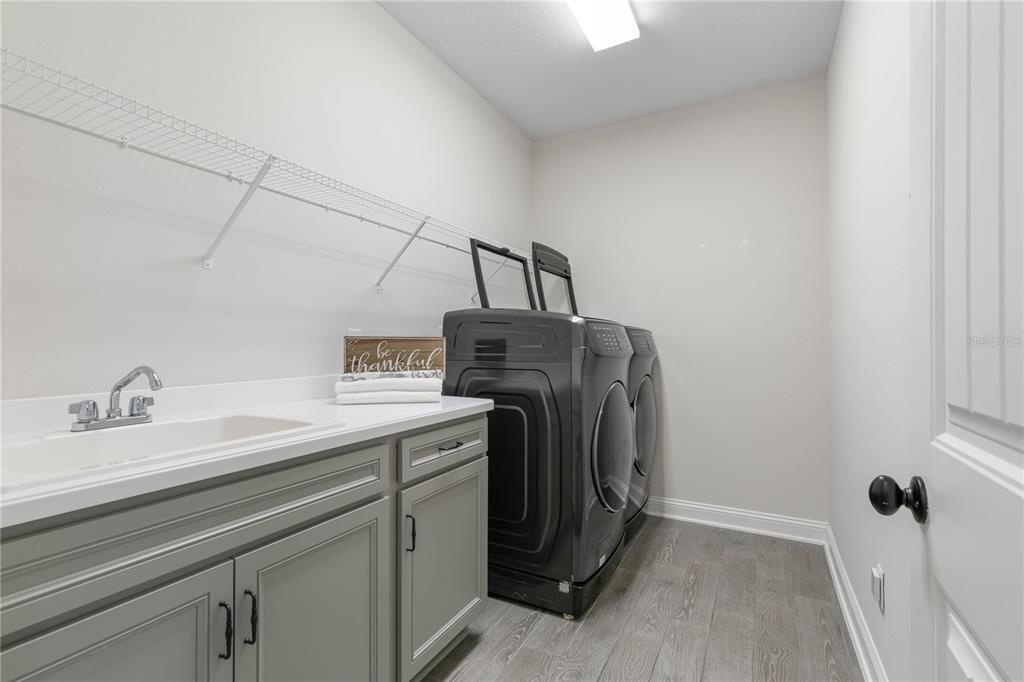 Laundry room with sink, counter & "Pedestal Washer/Dryer