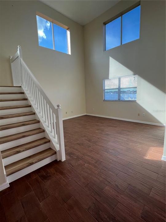 Vaulted ceiling in family room overseeing the serene pond.