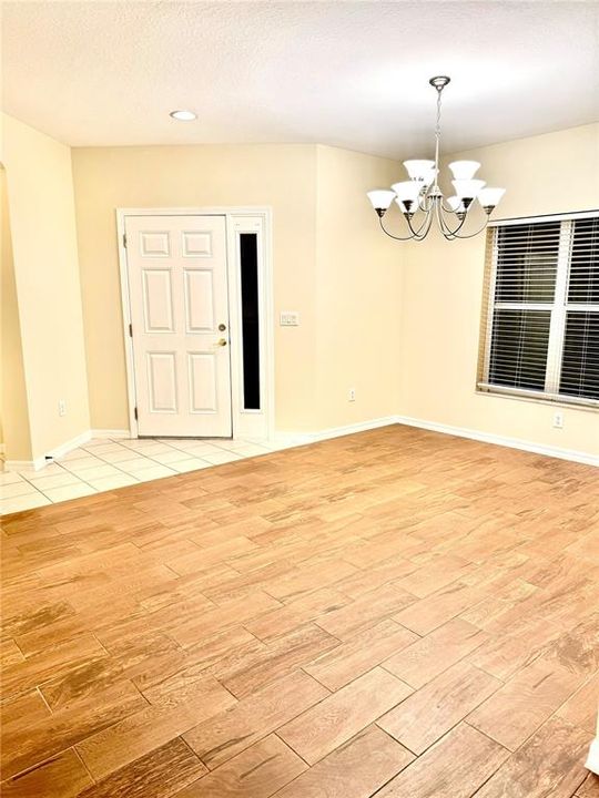 Enter into this beautiful dining room area with porcelain tile flooring.