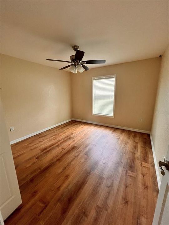 Bedroom 3 with ceiling fan and LVP Flooring