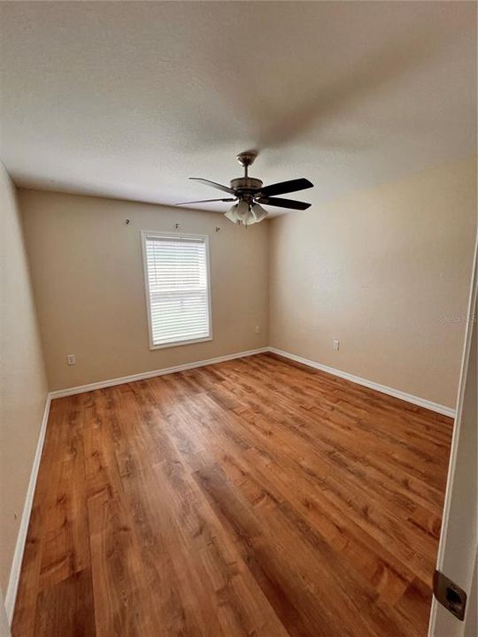 Bedroom 2/ ceiling fan and LVP flooring