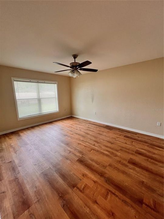 LVP flooring, ceiling fan in Primary