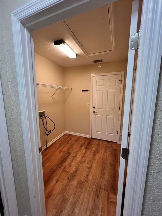 inside laundry room also has storage closet