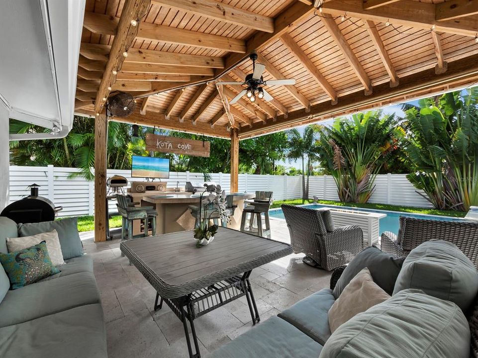 This pergola creates an amazing outdoor entertaining area or just relax overlooking the pool.