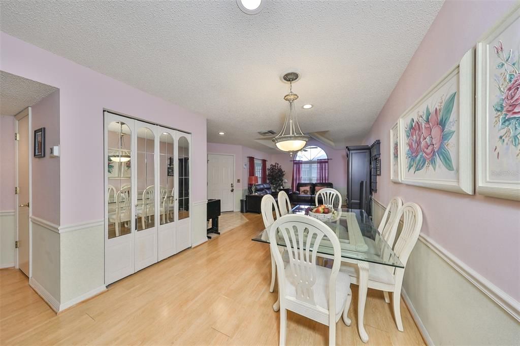 Additional storage cabinets are in the dining area, with mirrored accents to enhance the room.