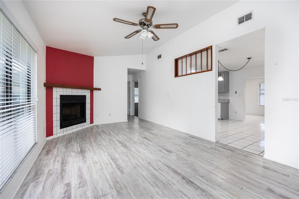 Living Room with high ceiling and fireplace