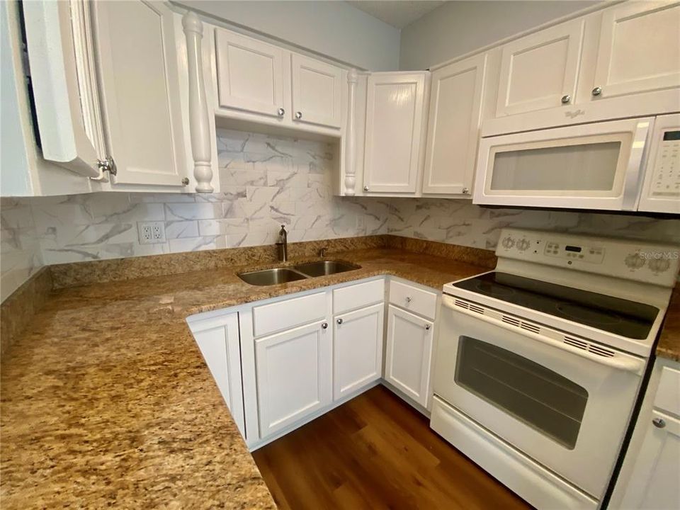 new paint, granite, tiled backsplash