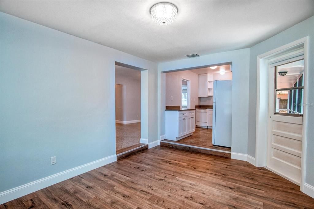 Dining room with porch exit next to laundry