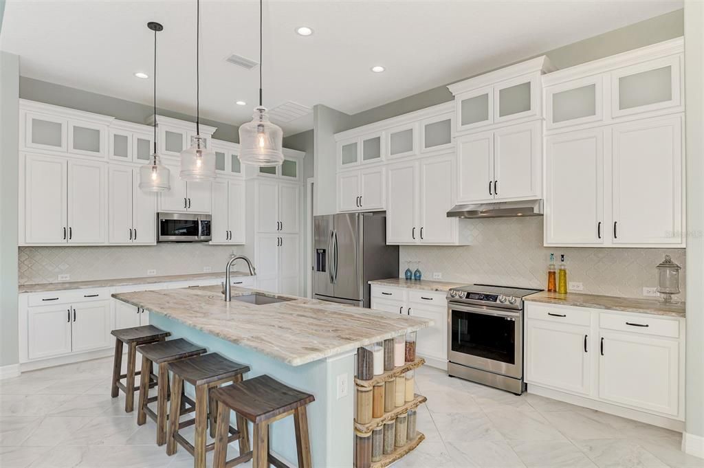 Custom wood cabinets with soft-close doors and drawers.  Plenty of counter space.