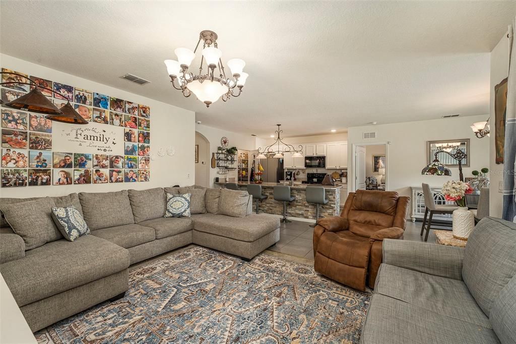 Living room is open to the heart of the home - the kitchen and breakfast bar