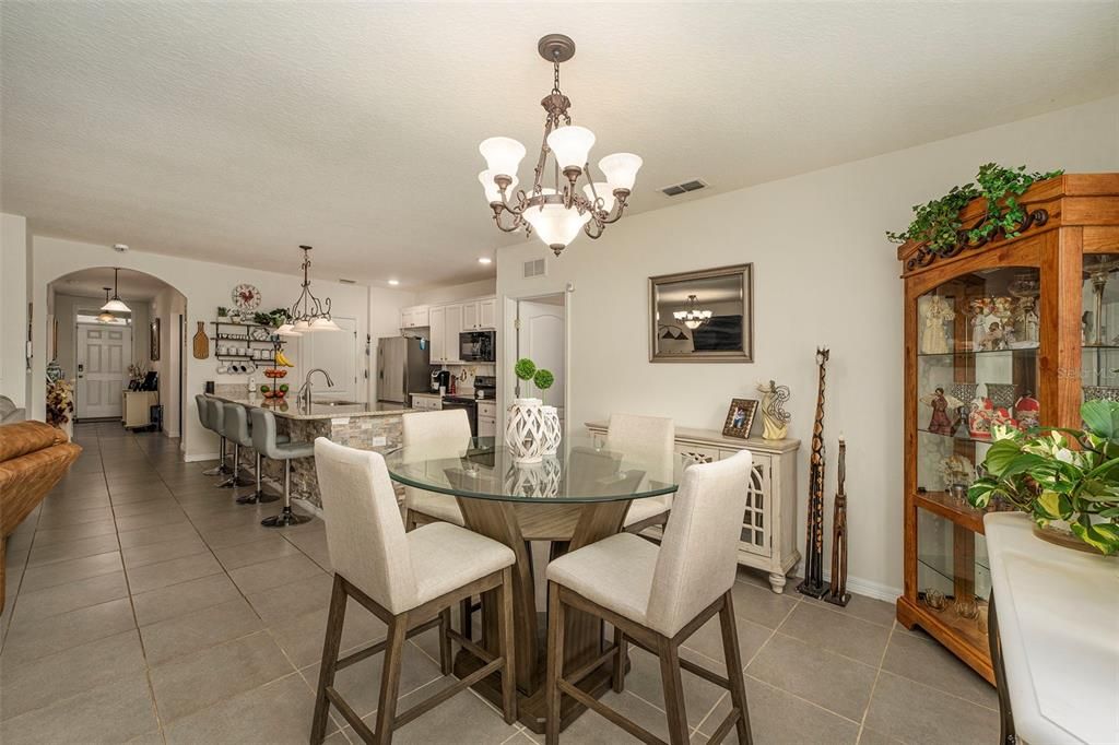 Eat in kitchen with double window, and sliding doors that lead to the screened lanai