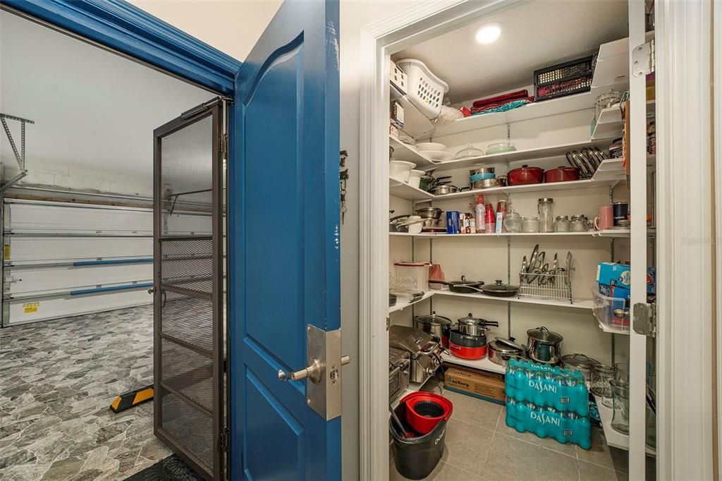 Garage opens to foyer and inside laundry room has been converted to an oversized pantry.  W/D on common wall in garage.