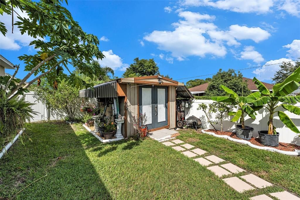 Beautiful Florida landscaping and fenced yard offers privacy and a perfect spot for your morning coffee!