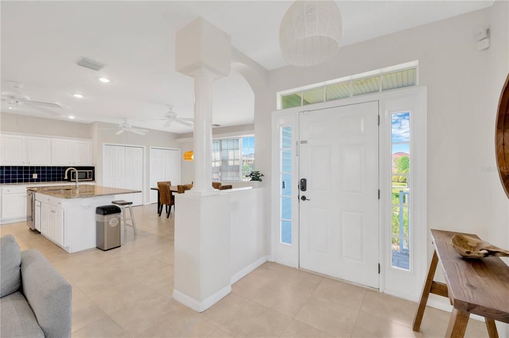 Front door and foyer leading into open floor plan on 2nd floor.