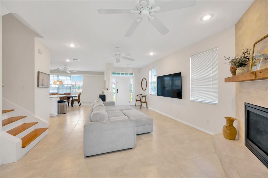 View of Living room, kitchen/Dining room access and front door.