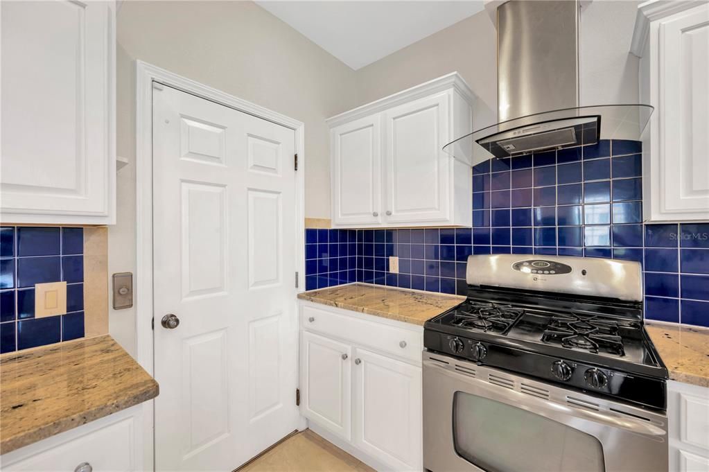 Enjoy gas cooking on this stylish SS range with plenty of prep space on both sides.  The door is access to the elevator for convenient grocery transport from the ground floor garage.