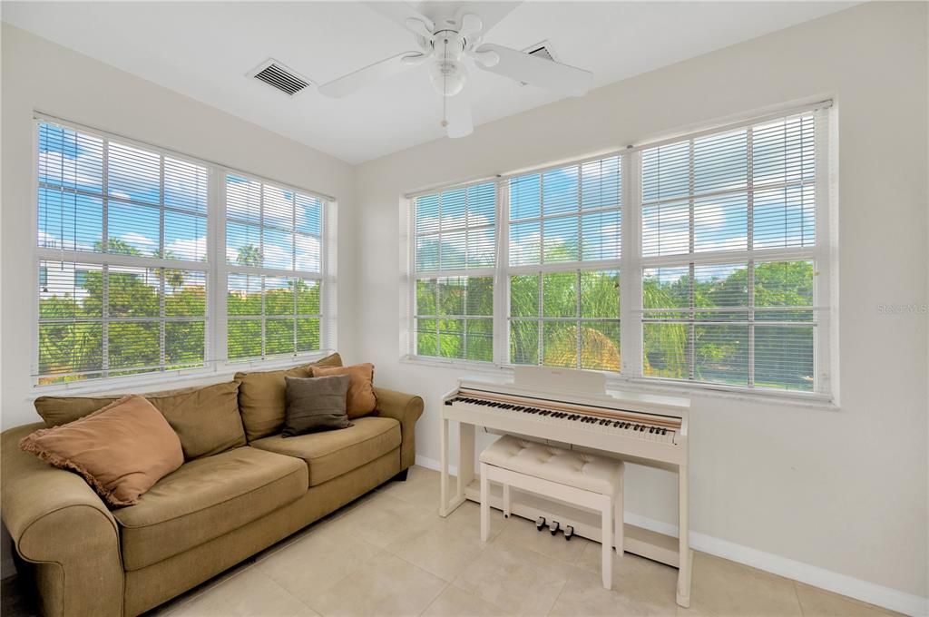 This room adjacent to the Living room is flooded with light and would be a perfect office or family flex space.