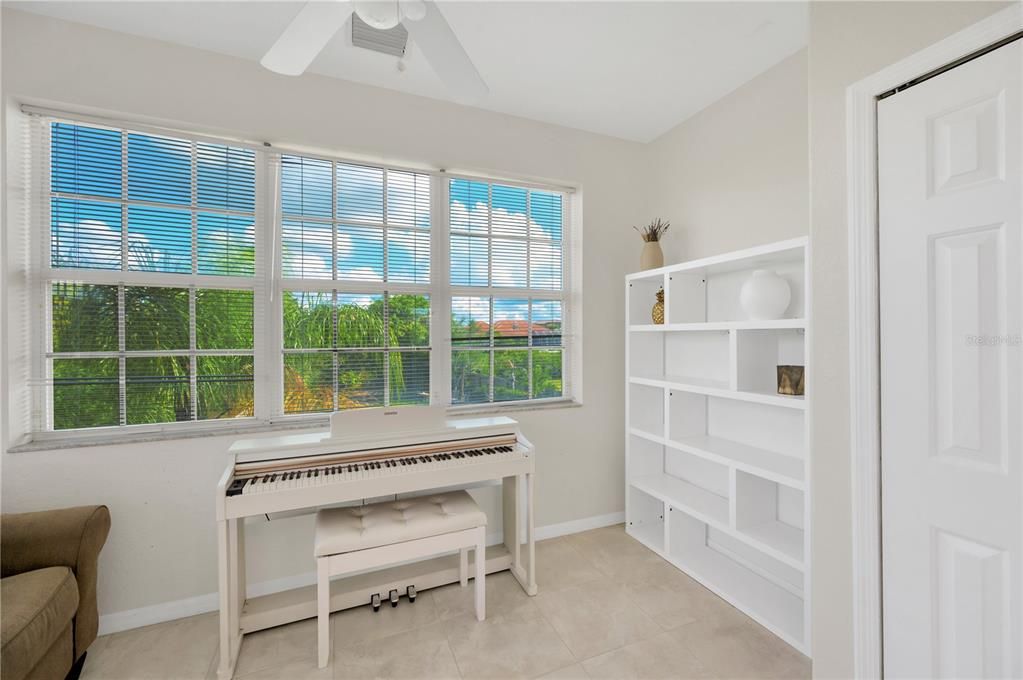 This family room/flex space looks east over the pool and canal.