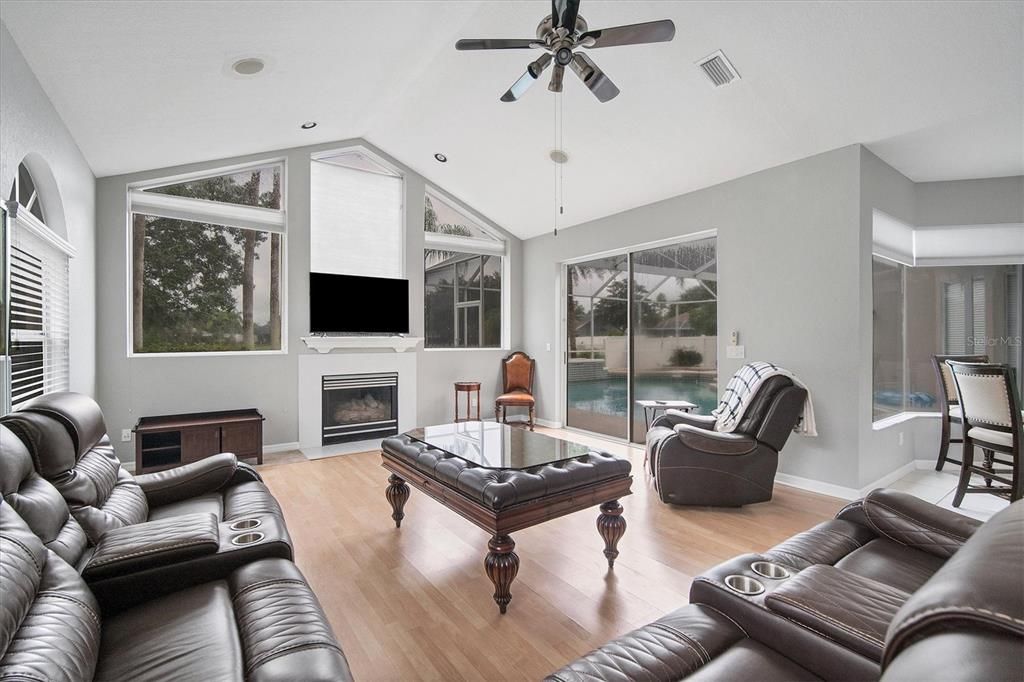 Family room overlooks backyard, pool and patio.