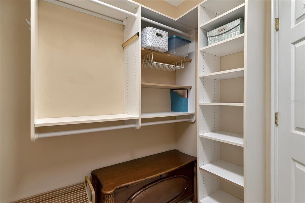 large walk in closet with built ins