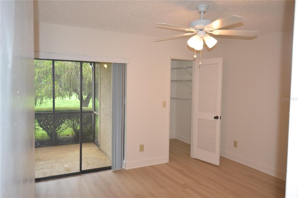 Primary Bedroom and large walk in closet and slider to the screened Lanai