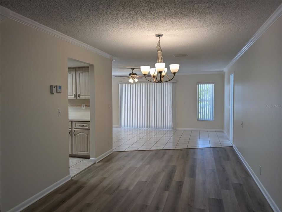 Dining room connects living room to Florida room.  View of kitchen on left.