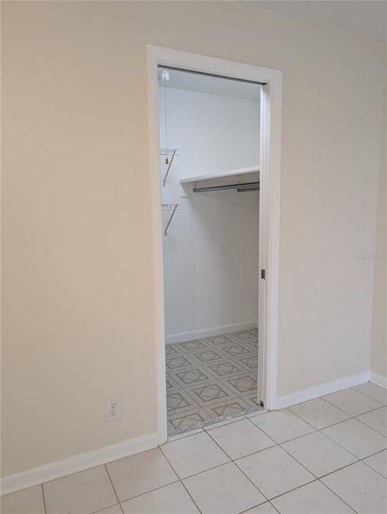 Guest bedroom walk in closet for extra storage.