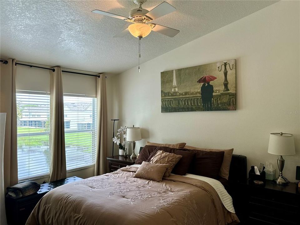 Primary bedroom overlooking pond