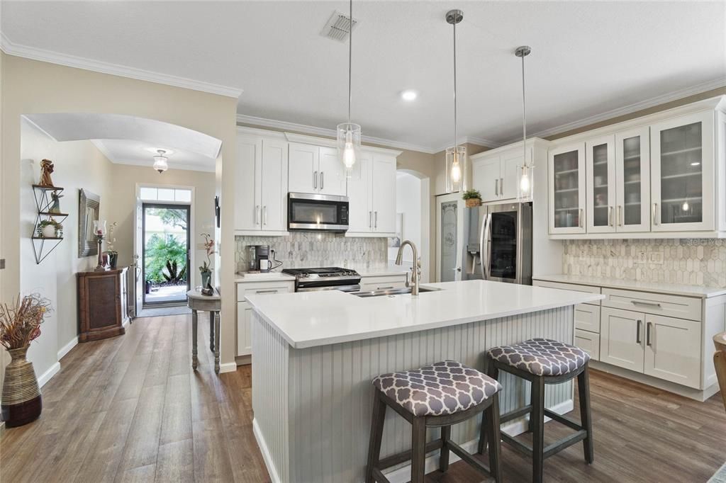 View of Kitchen w/ beadboard paneling on breakfast island