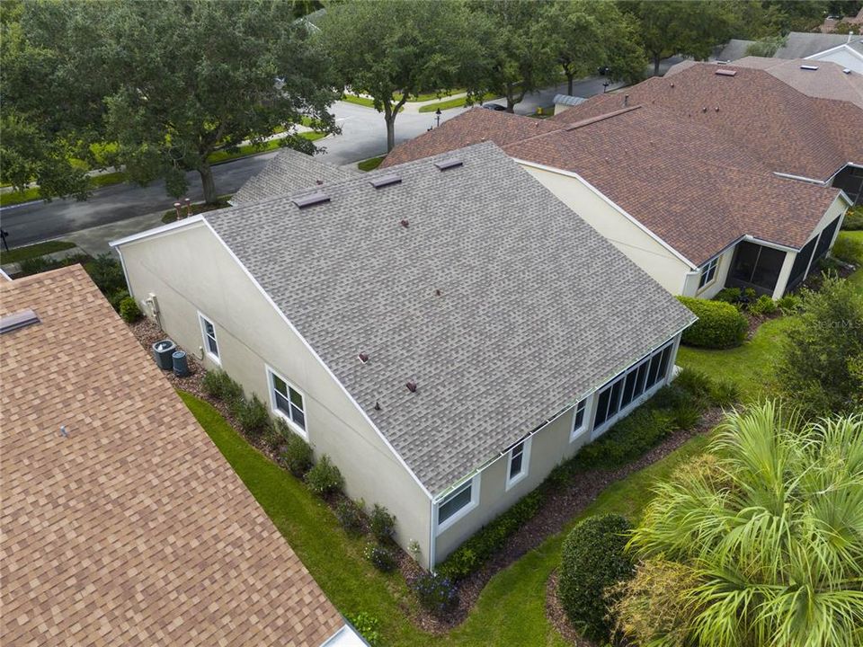 Aerial view of the rear of the home w/ a newer roof in 2022