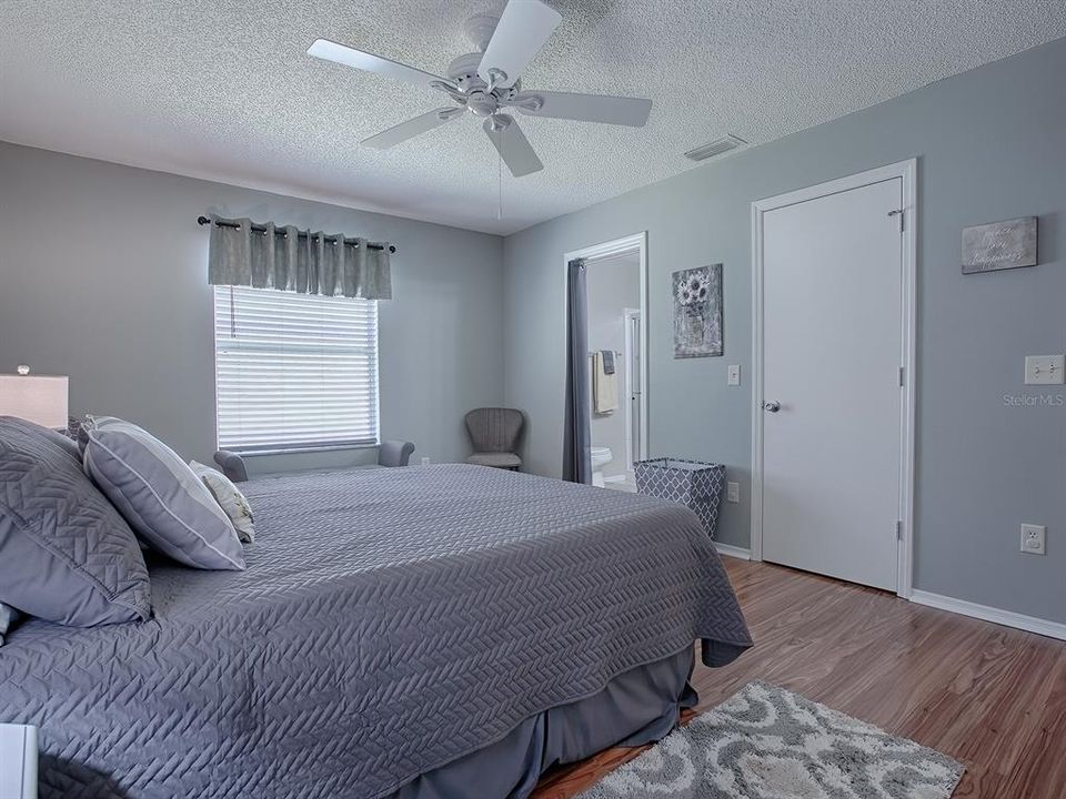 THE DOOR TO THE RIGHT IS A LARGE WALK-IN CLOSET AND TO THE LEFT IS THE EN-SUITE BATH.