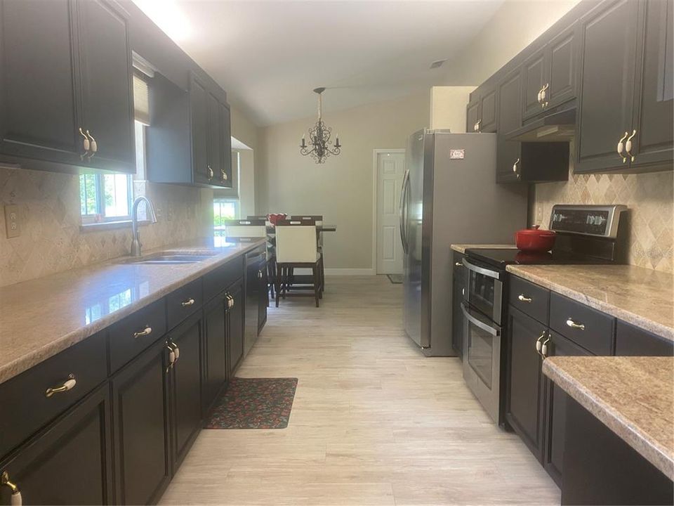 Galley Kitchen, Featuring Granite Counters.