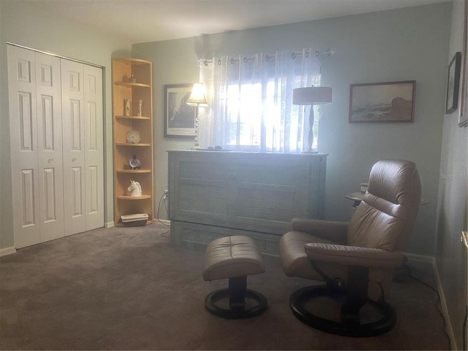 Murphy Bed in Guest Bedroom, Allows for Office Usage.