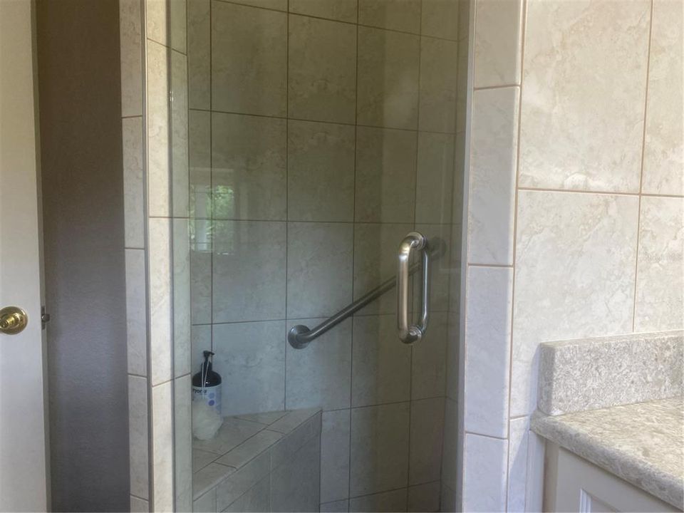 Primary Bath Tiled Shower, Seat & Grab Bar.