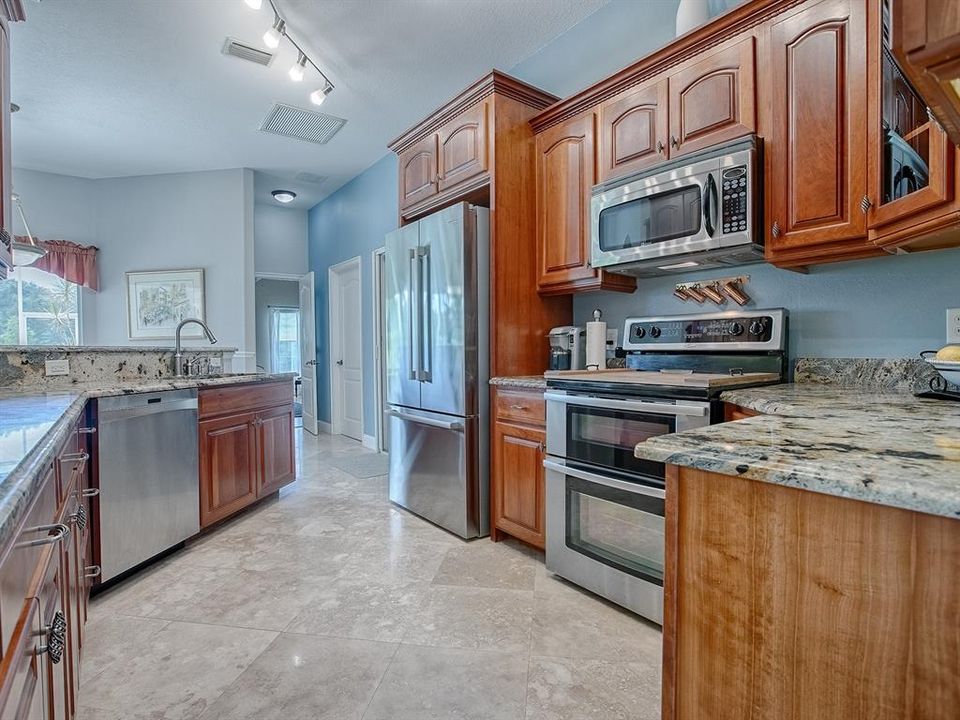 Granite counter tops, stainless steel appliances and beautiful floors!